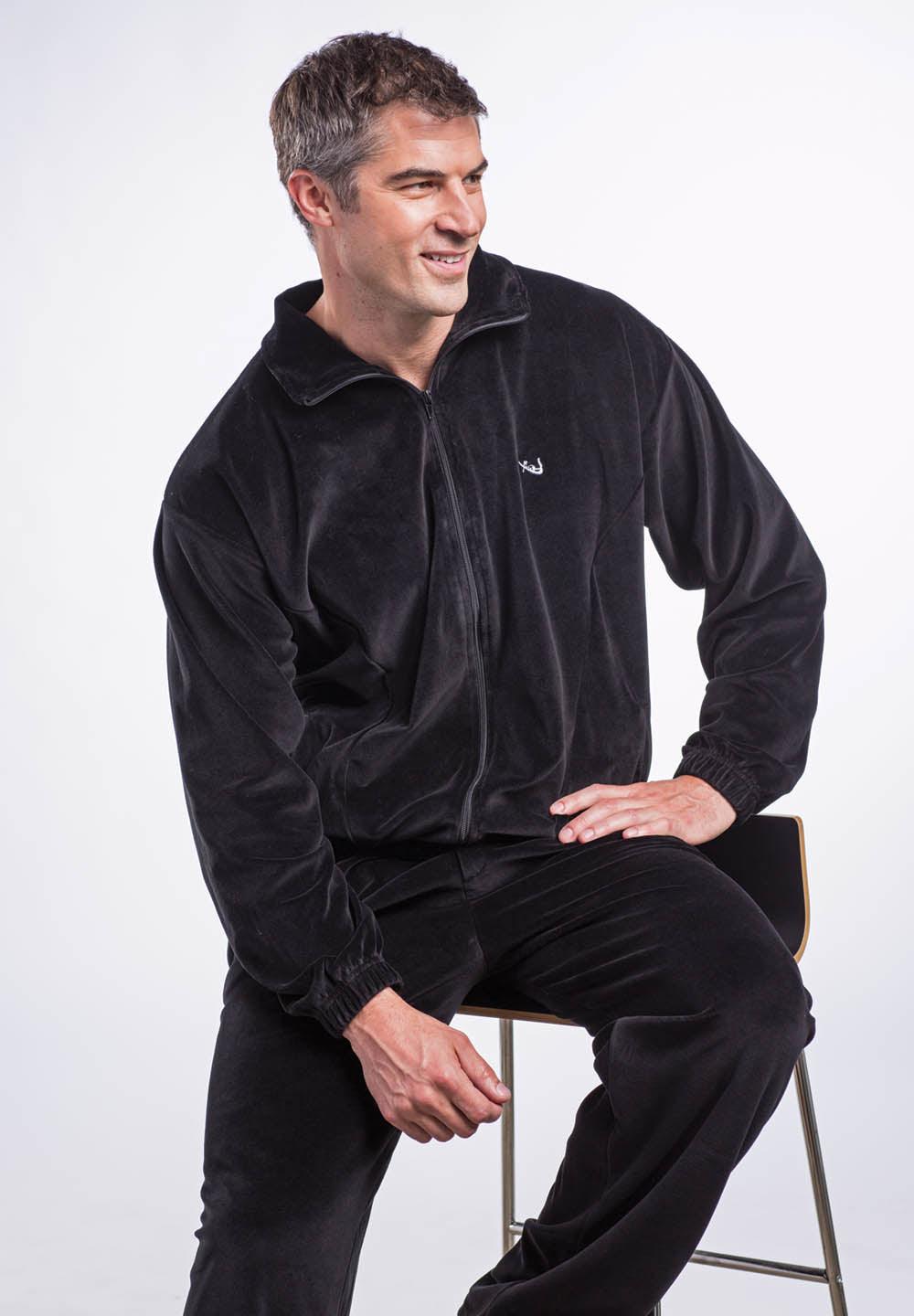 Microfiber velour fabric is outstanding. Chromed zipper detailing adds sophistication. Classic jacket style with side slash pockets and full zip, great for layering. Pant features a stretch waist band, tie front and classic pockets. Pants feature an open bottom. Made in Italy.