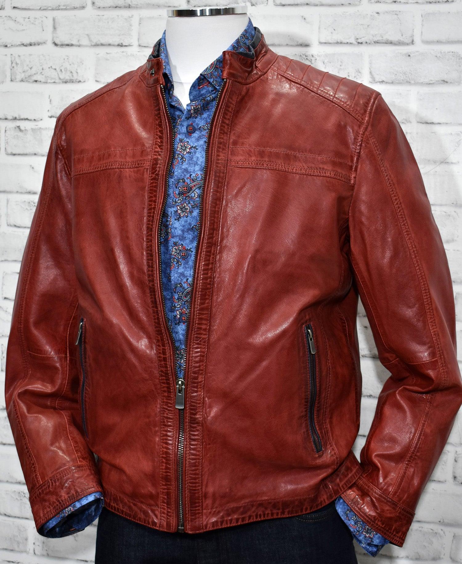 Our soft, distressed red leather coat features accent stitch work, contrast navy leather trim and a cool worn look. Red leather by Marcello Sport